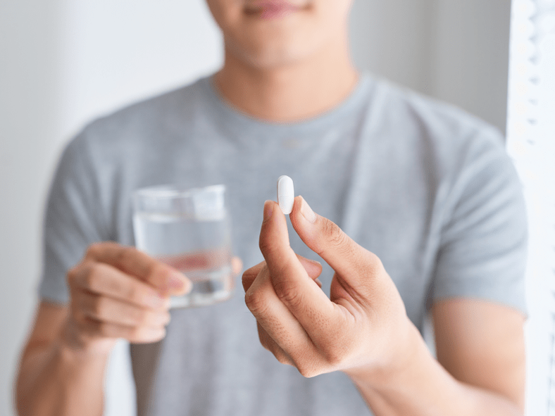 Man holding Weiprost capsule to treat prostatitis